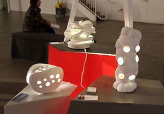 three lighted sculptures