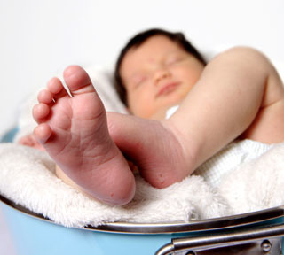 infant feet shows heel prick marks