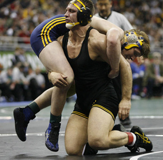 phil keddy lifts an opposing wrestler off the mat