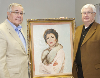 Jack and Mick Sharer, with portrait of their sister, Teresa (Sharer) Benoit
