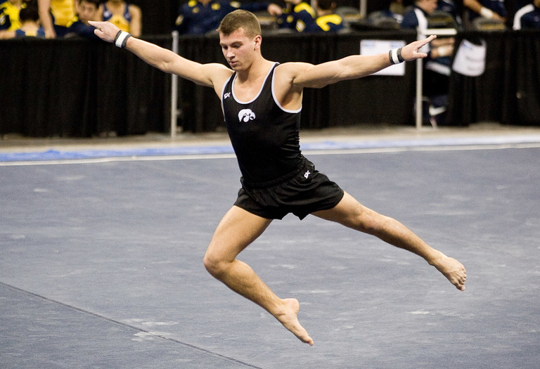 Iowa's Angelo Bronzino competes in the floor exercise.