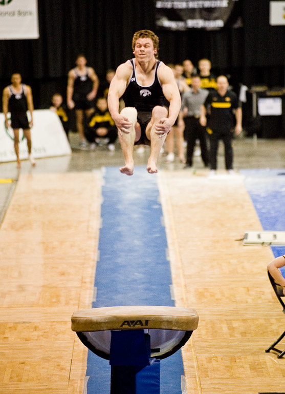 Matt McGrath in the midst of a triple flip while competing on the vault