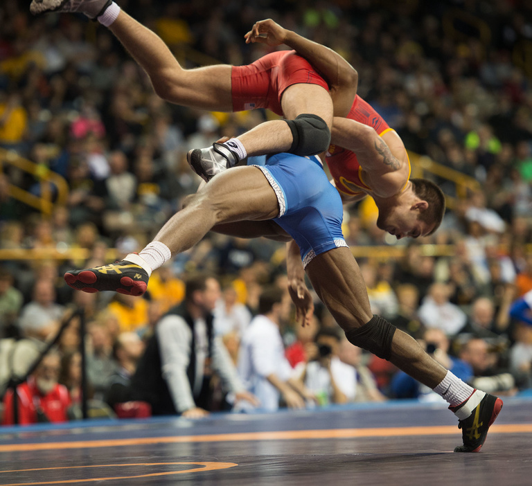 Day two of the Trials started well for Iowa wrestlers. Here, former Hawkeye great, Tony Ramos puts a move on Nahshon Garrett in his opening round match. Ramos came from behind to win the match.