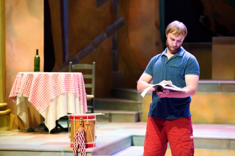 University of Iowa School of Music student Jordan Pohlmann studies his lines as he and other cast members rehearse their roles for their performance of Gilbert & Sullivan's "The Gondoliers" on Tuesday, June 30th. The comedic opera is being directed by Nic