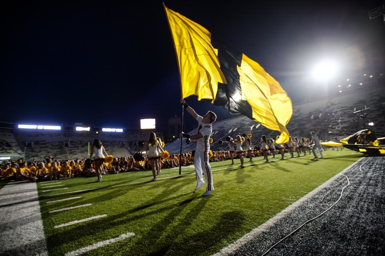The Iowa Spirit Squad helps new students learn the Iowa fight song during Kickoff at Kinnick.