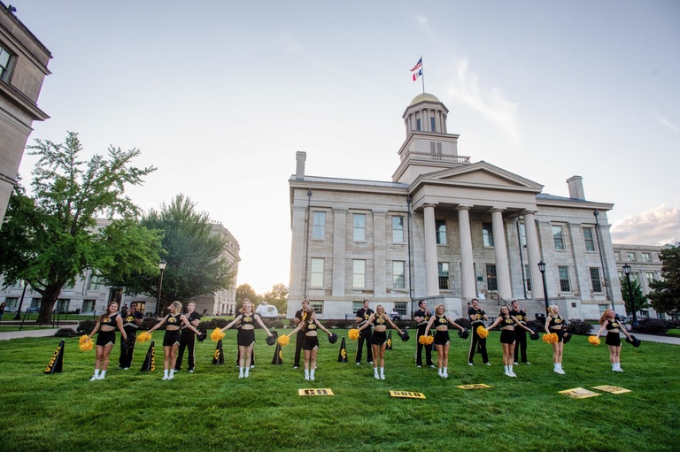 The University of Iowa Spirit Squad leads the crowd in cheers during the 2015 Beat State Pep Rally on Thursday, Sept. 10, 2015.