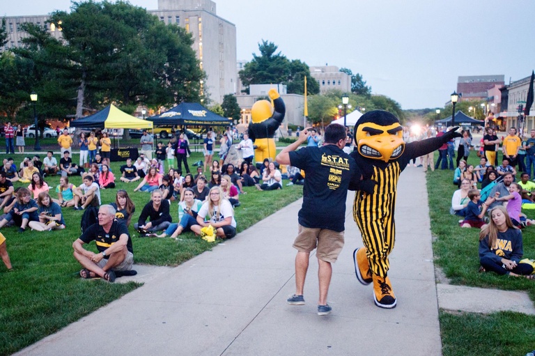 Herky celebrates the Hawkeyes with a fan during the Beat State Pep Rally.