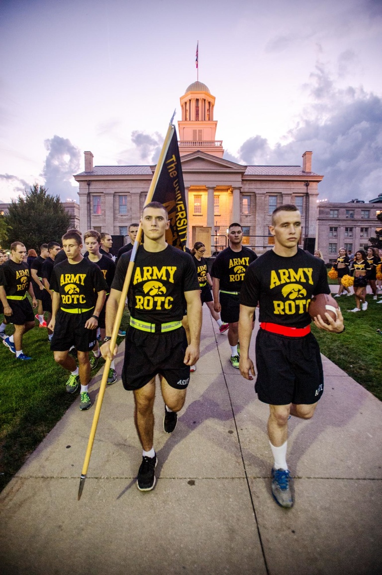 Members of University of Iowa Army ROTC depart for the 28th annual Army ROTC Game Ball Run, which carries the Cy-Hawk football series game ball from Iowa City to Ames.