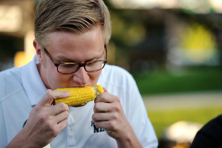 University of Iowa students and fans participate in the final heat of a corn cob-eating contest during the Beat State Pep Rally. 