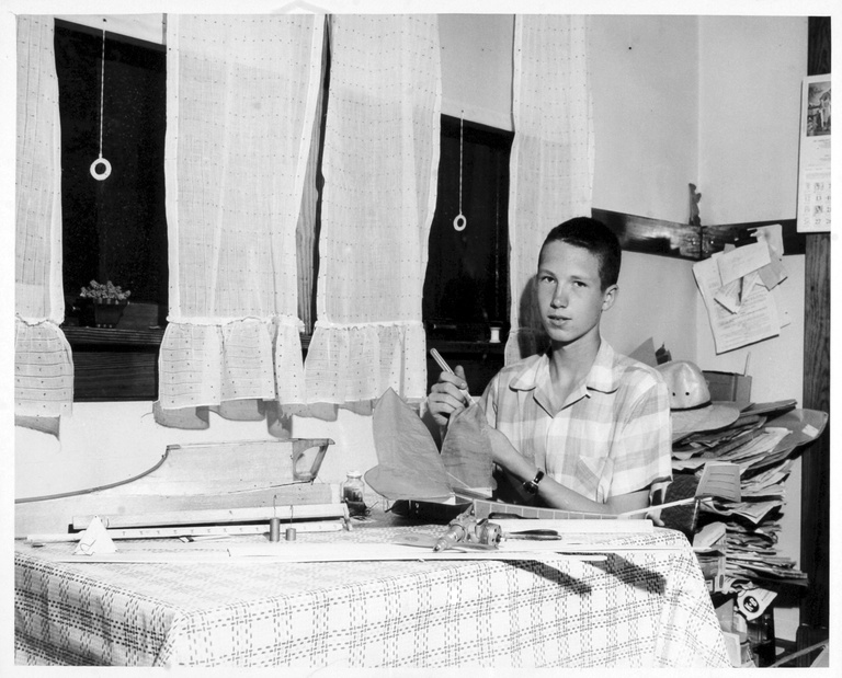 In this photo from 1956, Don Gurnett poses at his mother's kitchen table, where he designed and built model planes.