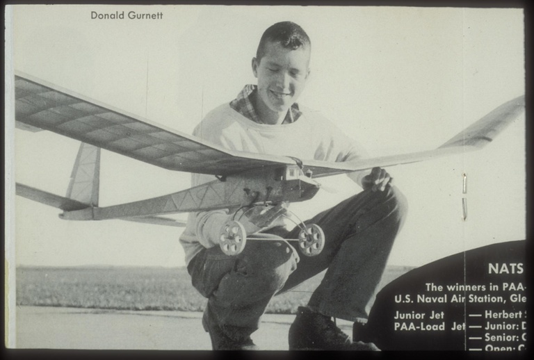 Don Gurnett competed in 1957 with his Clipper Cargo Hercules model in the Pan American World Airway event for model airplanes lifting the most weight in flight. He won the event at the Glenview Naval Air Station in Glenview, Illinois.