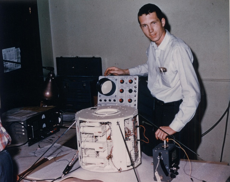 Don Gurnett is shown in 1961 with the University of Iowa's designed and built Injun 1 spacecraft.