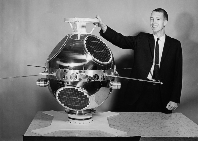 Don Gurnett, project engineer for the Injun 3 spacecraft launched in 1962, points to the low frequency radio antenna on the first plasma wave instrument flown on a University of Iowa spacecraft.