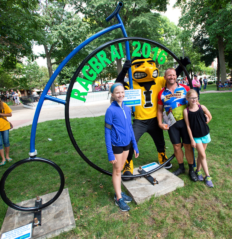 people with Herky by RAGBRAI sign