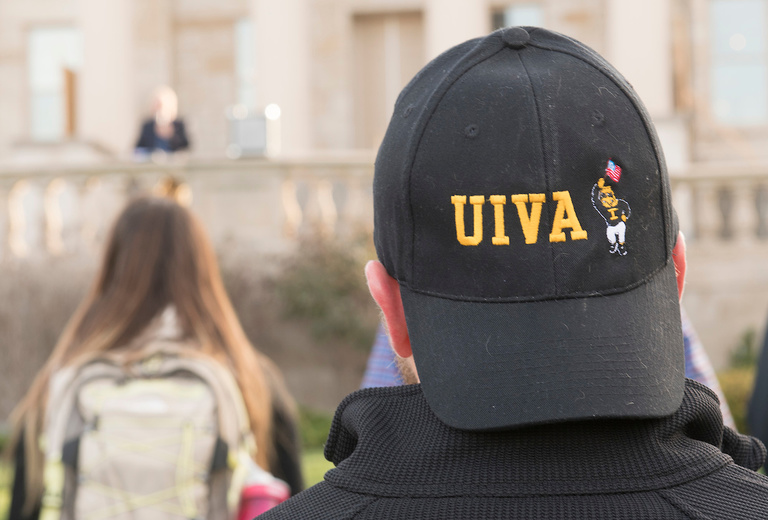 A member of the University of Iowa Student Veterans Association participates in the Veterans Day ceremony on the west lawn of the Pentacrest on Friday, Nov. 11, 2016.