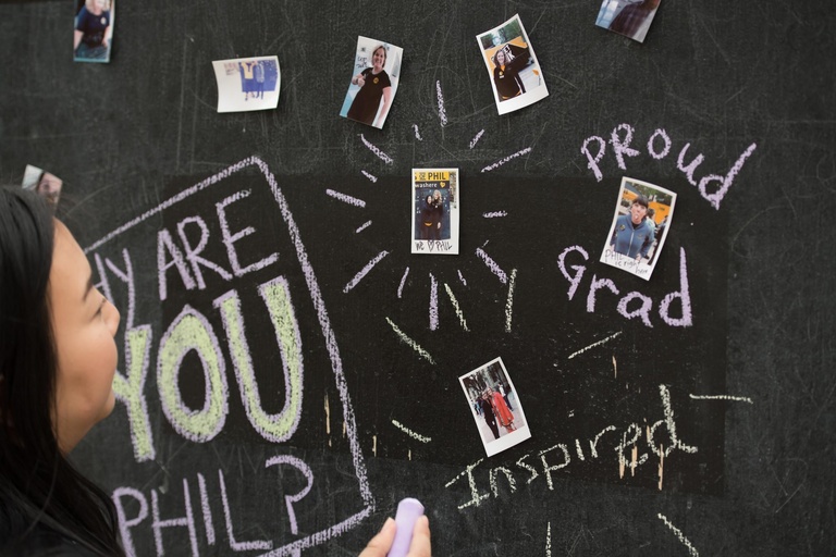 “Faces of Phil” event participants were invited to write their own messages about philanthropy on the large chalkboard display.