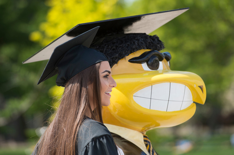 young woman with graduation herky