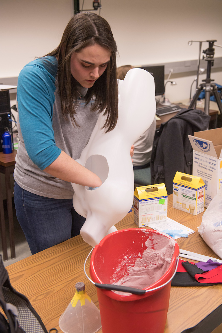 Ashten Sherman gets the mannequin ready for testing. Photo by Tim Schoon.