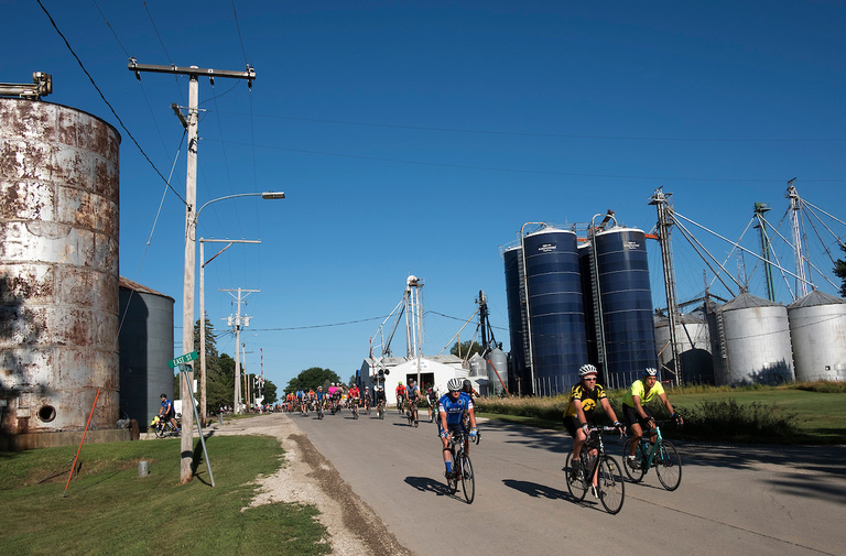 cyclists leaving small Iowa town during ragbrai 2018