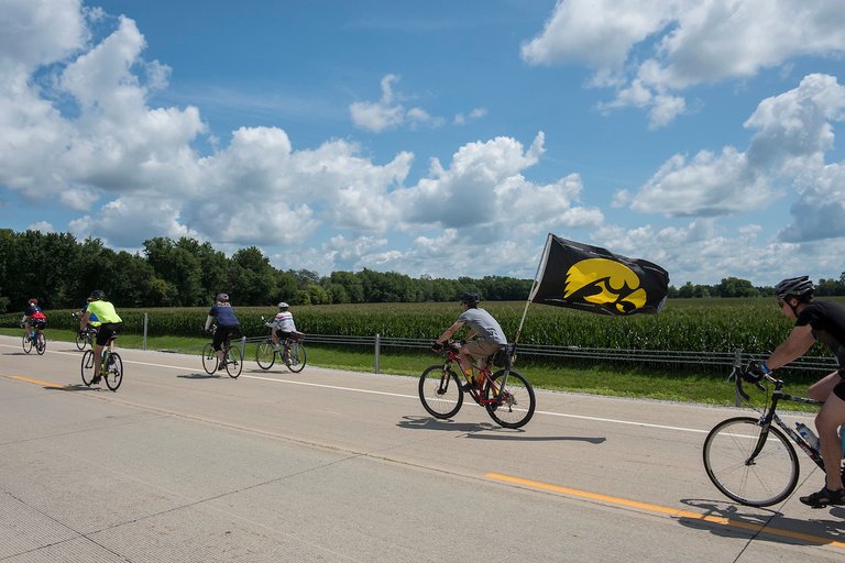 a large tiger hawk flag flutters in the wind during ragbrai 2018