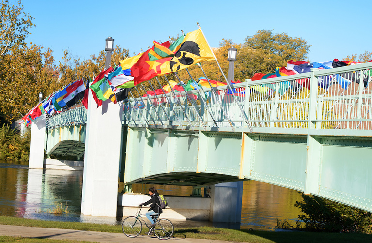 flags representing the home countries of university of iowa international students fly on the IMU footbridge