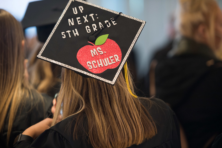 mortarboard decorated with apple