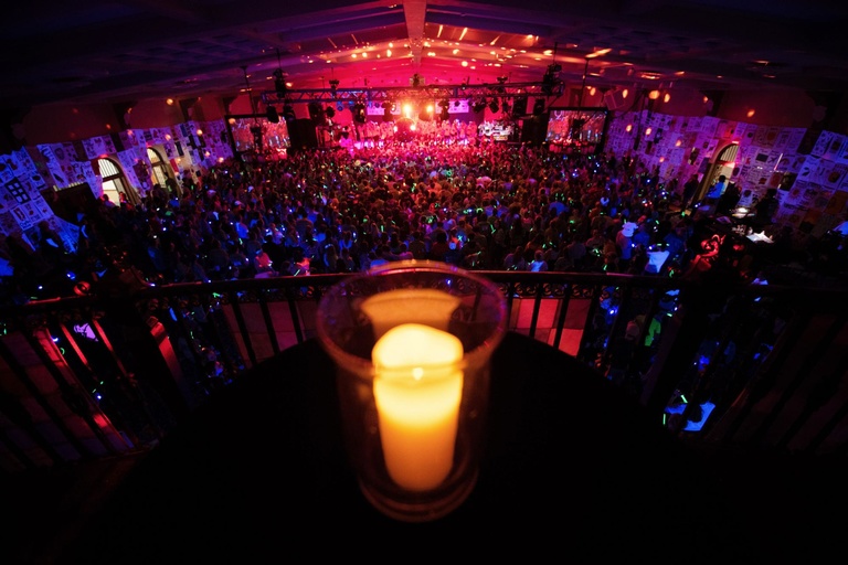 lit candle above dance floor
