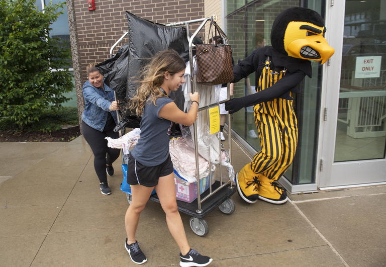 herky pulls dolly during on iowa move-in