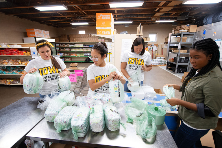 public health students bagging diapers during day of service
