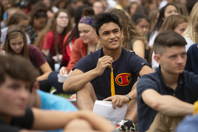 new student holds tassel during convocation and block party 2019