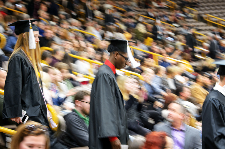 graduates descend stairs