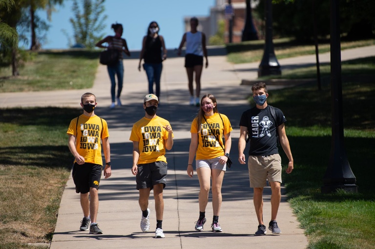 new students walk through campus