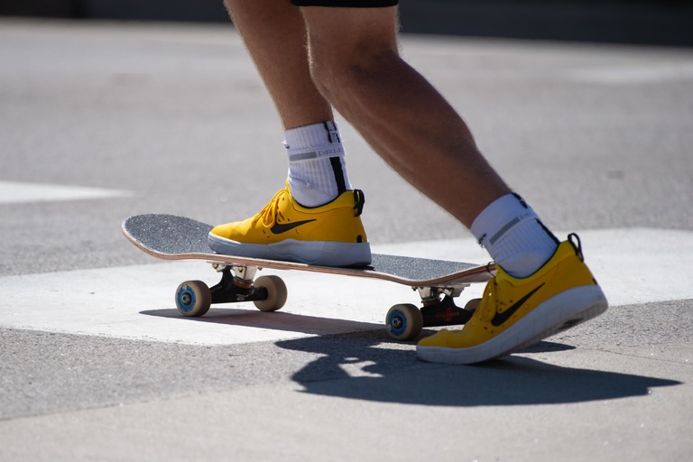 gold shoes on skateboard