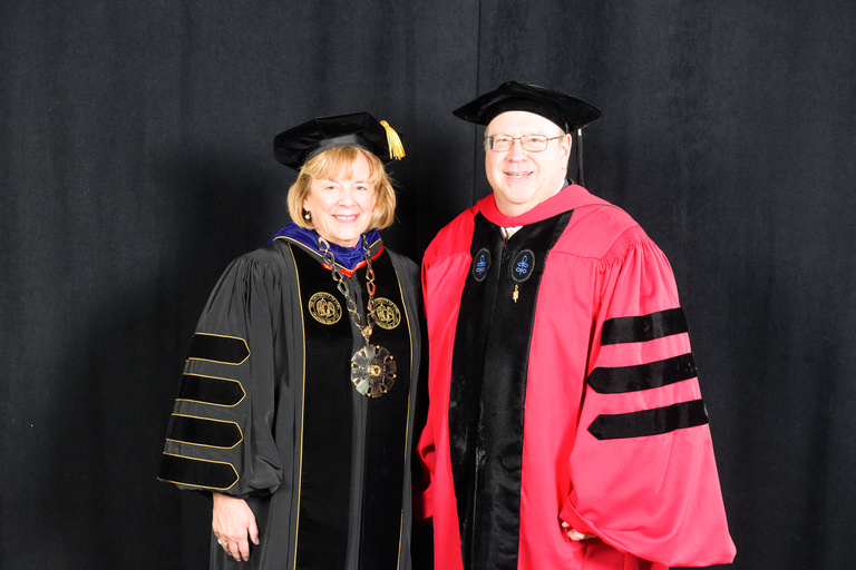 President Wilson and Roy J. Carver Chair in Neuroscience Ted Abel pose for a photo.