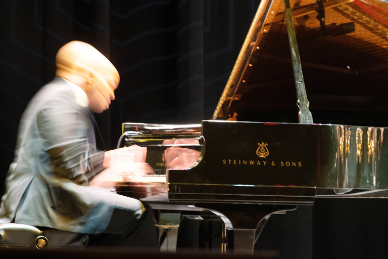 Associate Professor in Jazz Studies William Menefield plays the piano during a jazz performance.