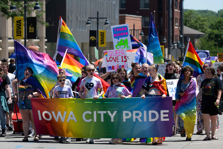 The Iowa City Pride Parade cheers its way through downtown Iowa City.