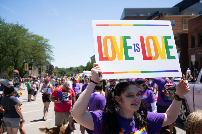A parade attendee spreads the word during the Pride Parade: Love is love.