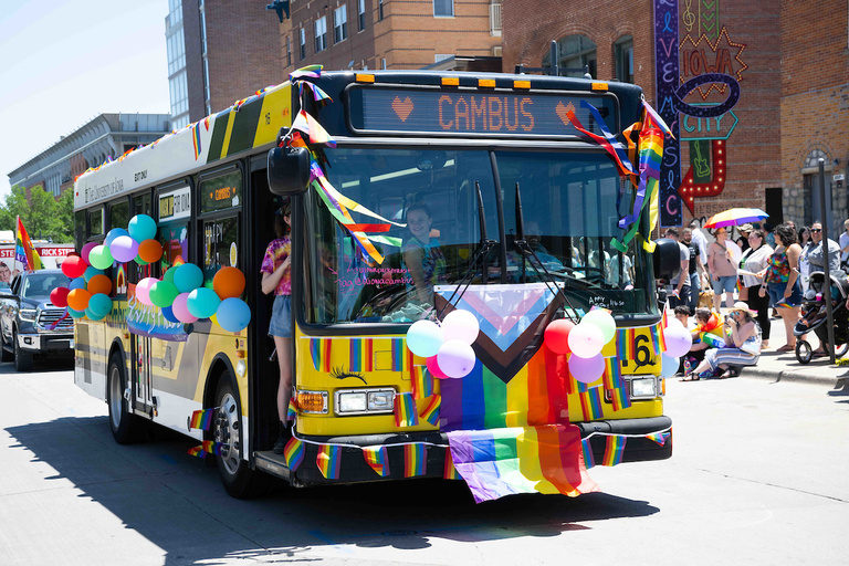 A University of Iowa CAMBUS is decked out in Pride colors for the parade.