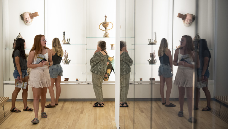 Visitors explore the various sculptures during the UI Stanley Museum of Art's inaugural exhibition, 'Homecoming'.