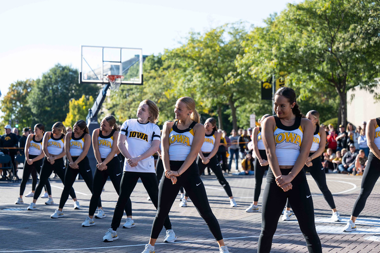 The Iowa Spirit Squad performs on Iowa Avenue during Hawkeye Hoops Downtown on Friday, Sept. 30.