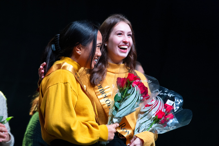 UI students Meghan Funk and Jordan Geriane congratulate each other on being named 2022 homecoming royalty.