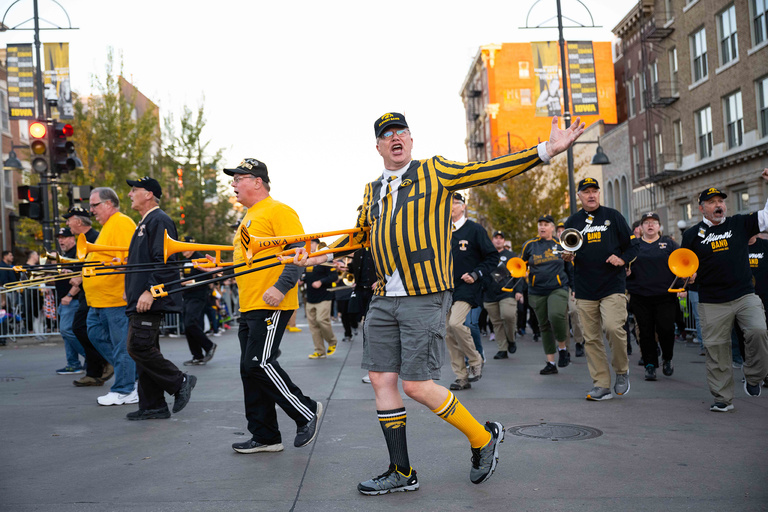 It's like they never left. Members of the UI Alumni Band put on their best performance during the homecoming parade.