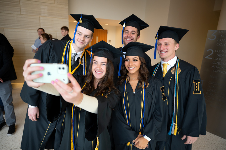 These students take a few "before" selfies ahead of the Tippie College of Business Commencement Ceremony, Saturday, Dec. 17.