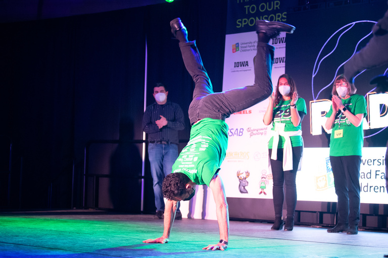 Dr. Alexander Bassuk, physician-in-chief and chair of pediatrics at UI Stead Family Children’s Hospital, does a cartwheel on a challenge for a donation.