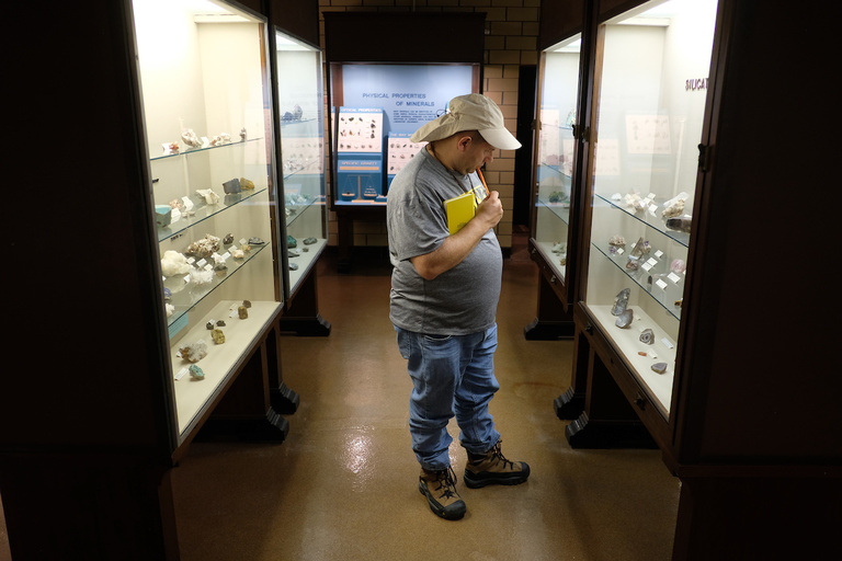 Mike Simon, gazes at specimens at the Missouri Mines State Historic Site.