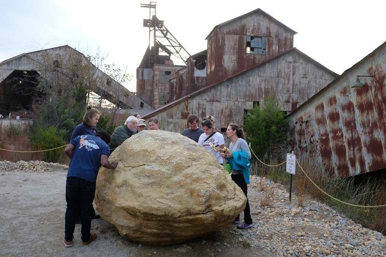 Students in the Earth and environmental sciences department examine a specimen at the Missouri Mines State Historic Site. 