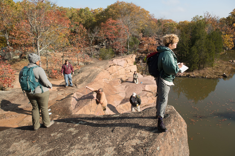 Geology students Diana Edmond (left) and Leigha Meredith (right) peer out on to a quarry at Elephant Rocks State Park.
