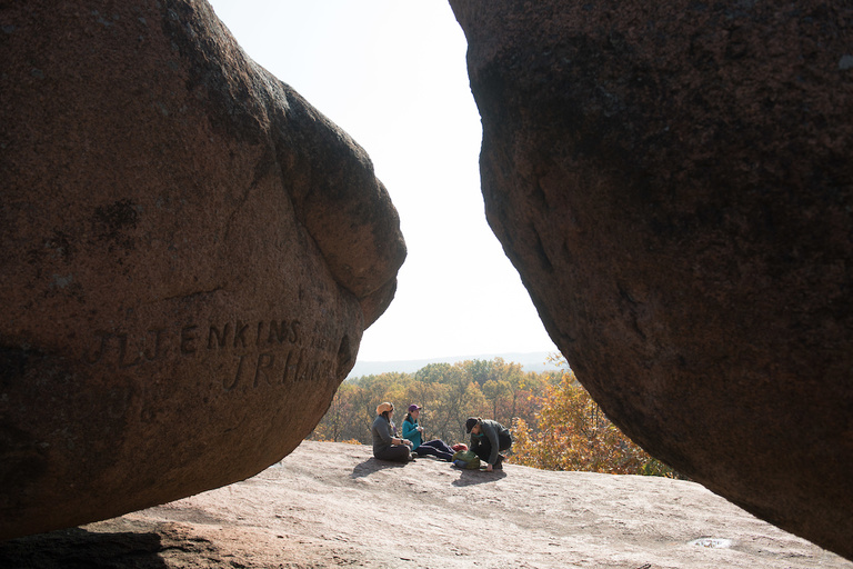 Break time: Faculty and students in the pause for a snack at Elephant Rocks State Park. The park is considered a geological classroom where visitors can see and touch some of the oldest rocks in the south-central and eastern United States.