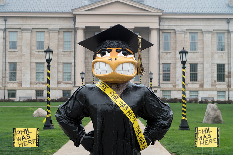 Graduation Herky returned to the Pentacrest just in time for Phil’s day—and wore a sash to celebrate.