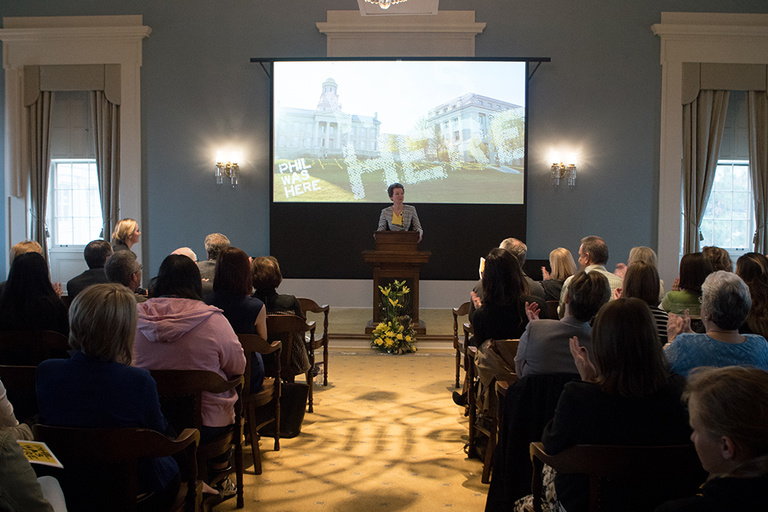 UI grad P. Sue Beckwith, M.D., delivered her “Life With Phil” address to a standing-room-only crowd in the Senate Chamber of the Old Capitol Museum.
